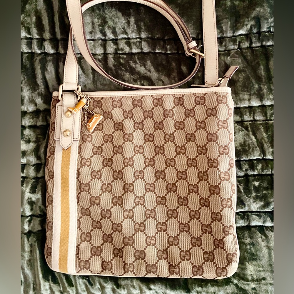 Gucci Joliecoeur Crossbody with charms and adjustable strap.